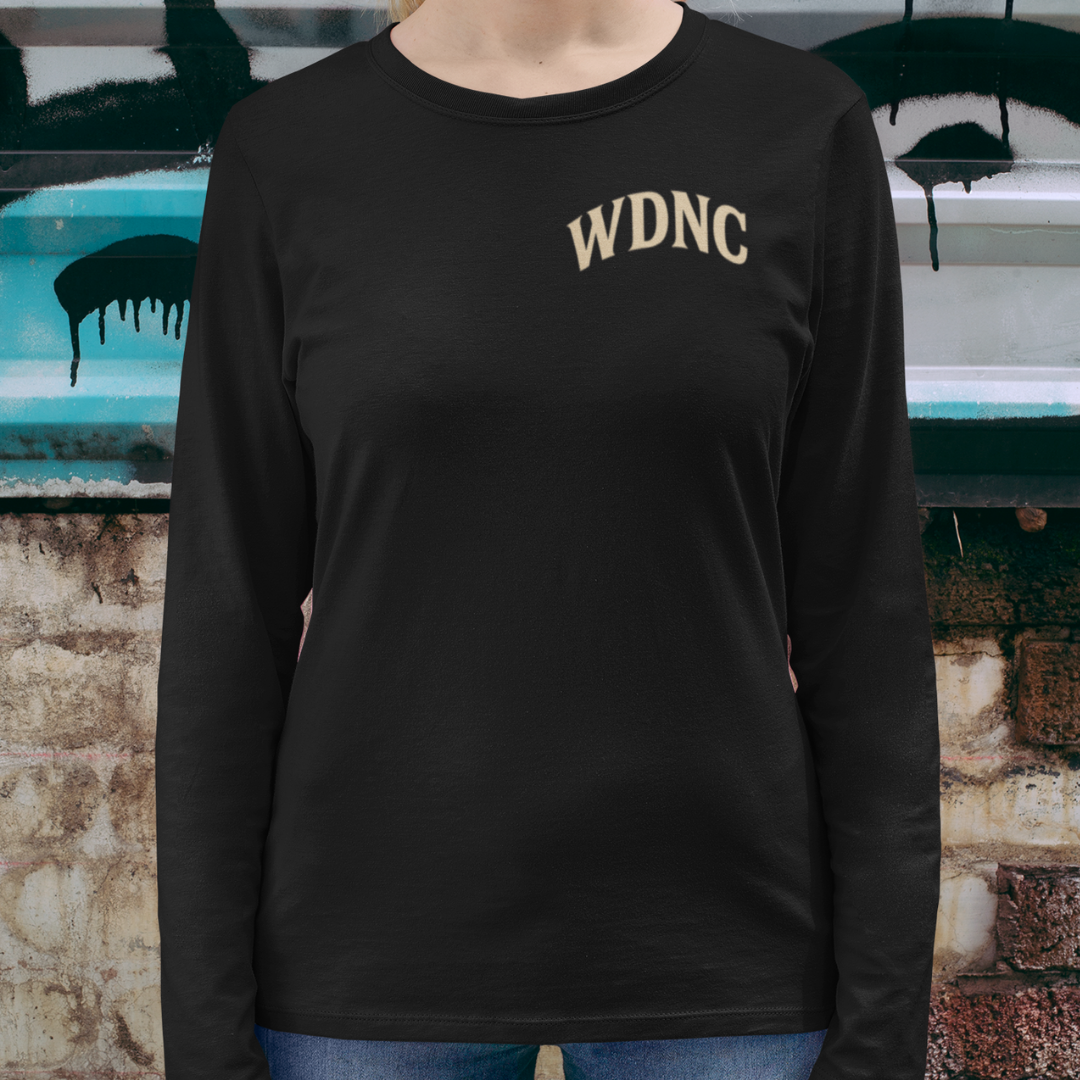 Unisex plus-size long sleeve graphic tee featuring “We Do Not Care Club” slogan and bold skull with roses print – limited-edition fearless streetwear