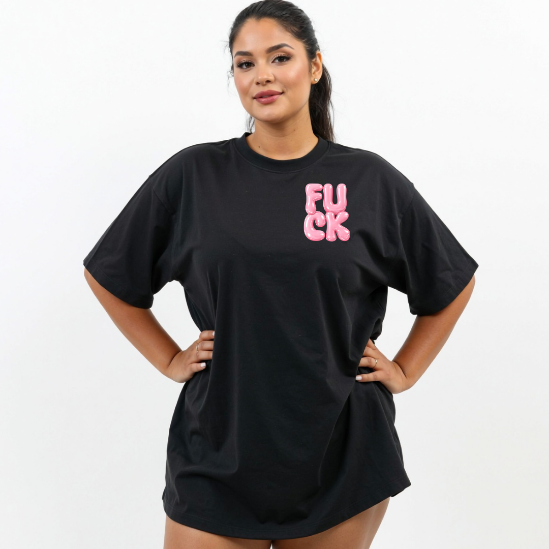 Person wearing a black t-shirt with pink text on a white background