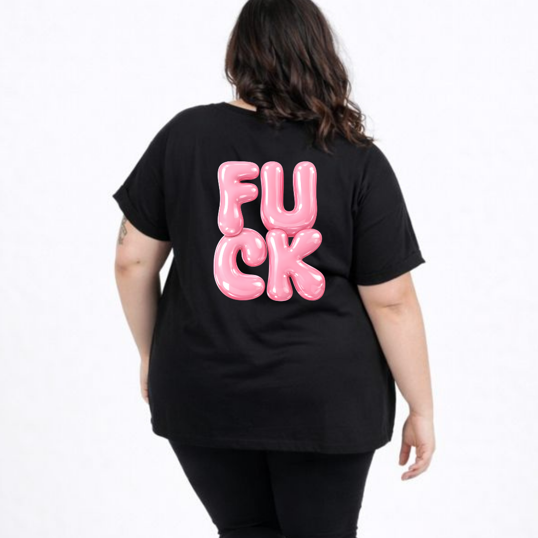 Person wearing a black t-shirt with pink text on the back against a white background