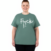A woman modeling a sage green crewneck t-shirt with the word 'F*ck' printed in white script across the chest, set against a plain white background.