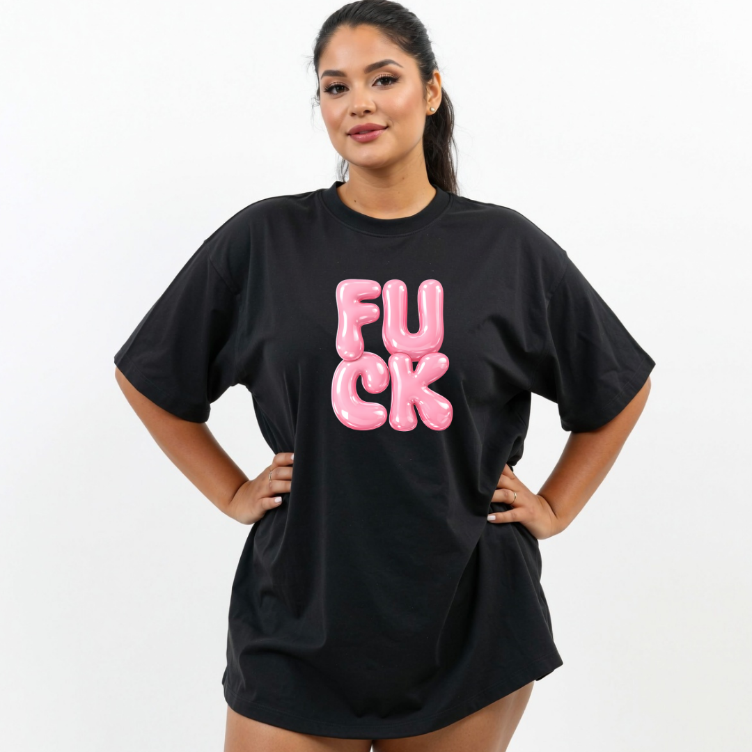 Person wearing a black t-shirt with pink text on a white background