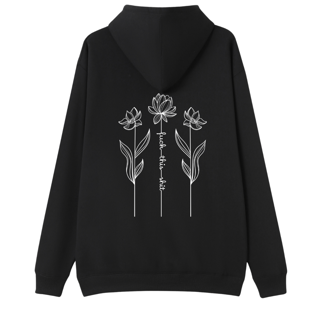 A black pullover hoodie with a white graphic print on the chest featuring a skull, stars, and the text 'DOG HAIR IS MY GLITTER'.