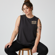 Front view of woman wearing black stonewashed Fun Fact I Don't Care tank top, relaxed fit, bold distressed slogan print, plus size Australian streetwear by Bae Bands