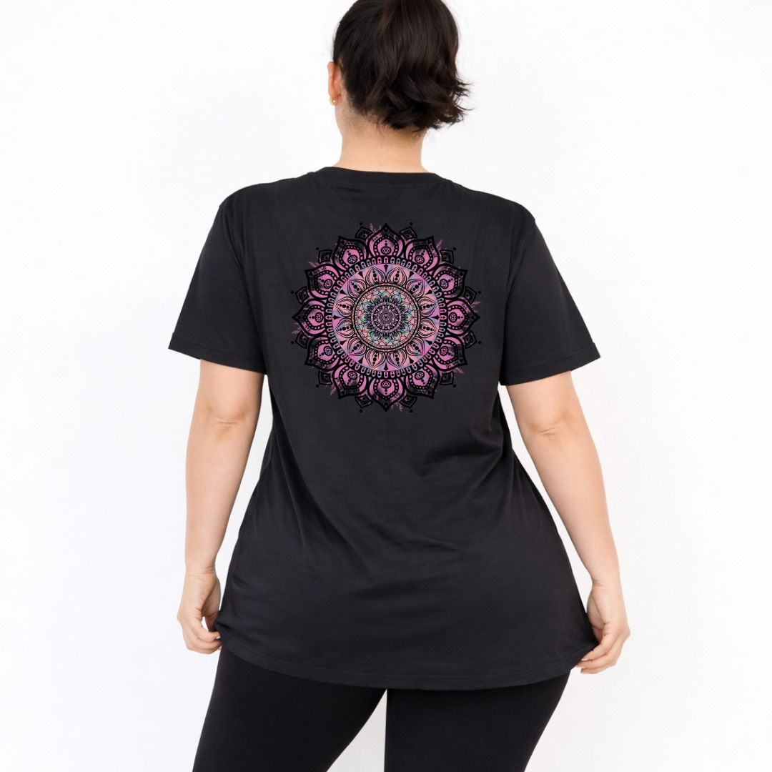 Woman wearing black oversized graphic tee with large intricate pink and teal mandala back print, plus size Australian streetwear by Bae Bands