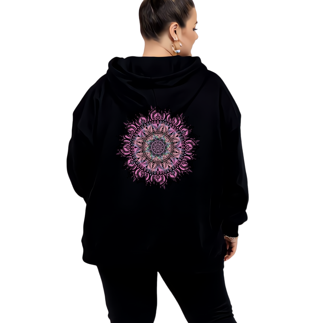 Woman wearing black oversized graphic hoodie with large intricate pink and teal mandala back print, plus size Australian streetwear by Bae Bands