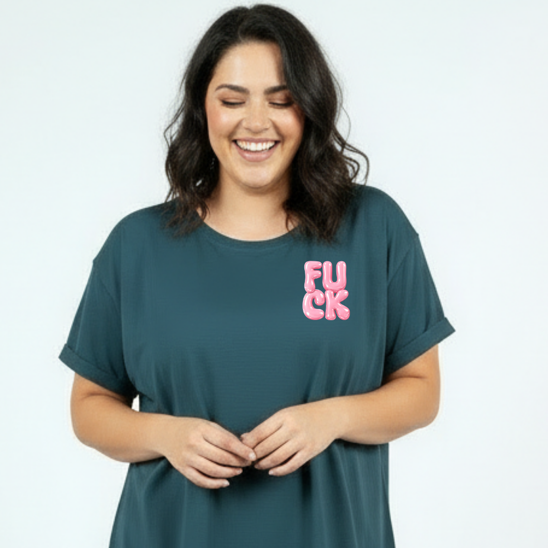 Woman wearing a teal t-shirt with pink text on a light gray background