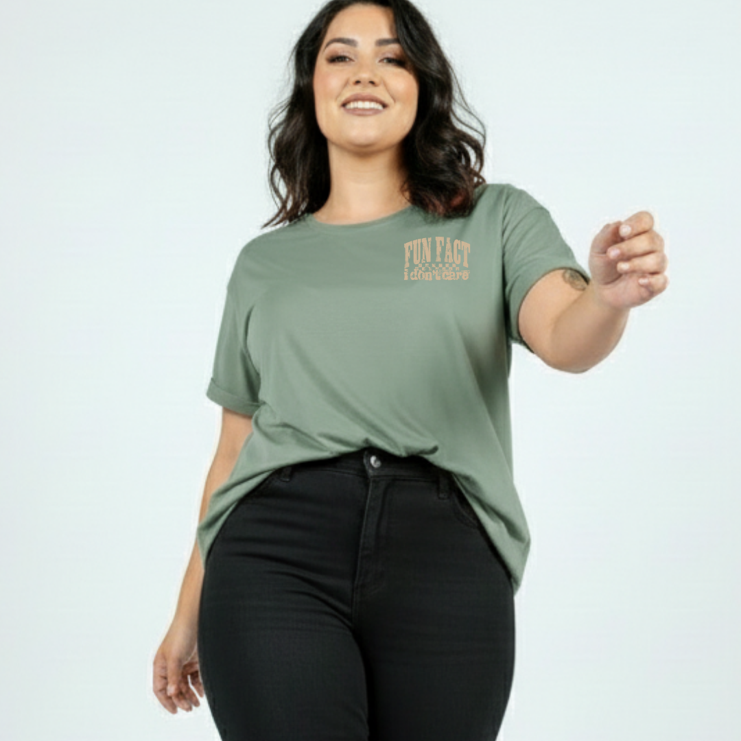 Woman wearing slate green oversized graphic tee with Fun Fact I Don't Care distressed varsity text print, plus size Australian streetwear by Bae Bands
