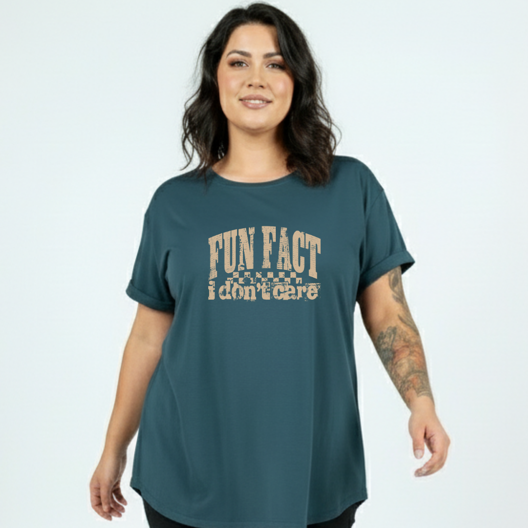 Front view of teal Fun Fact I Don't Care oversized tee showing relaxed plus size fit, bold distressed text DTF print, Bae Bands Australia