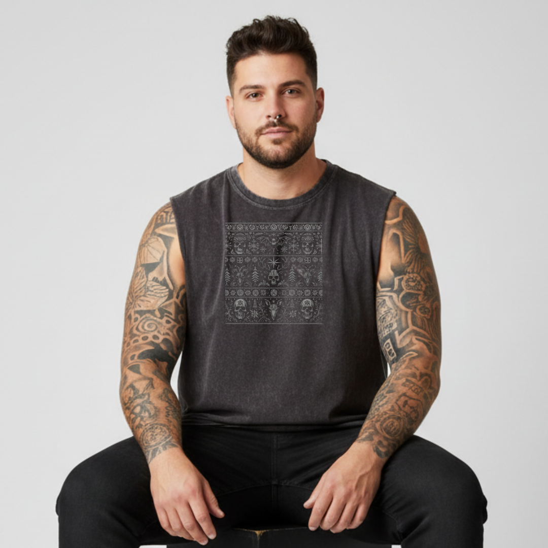 Man wearing a dark sleeveless shirt with a geometric pattern on a light gray background