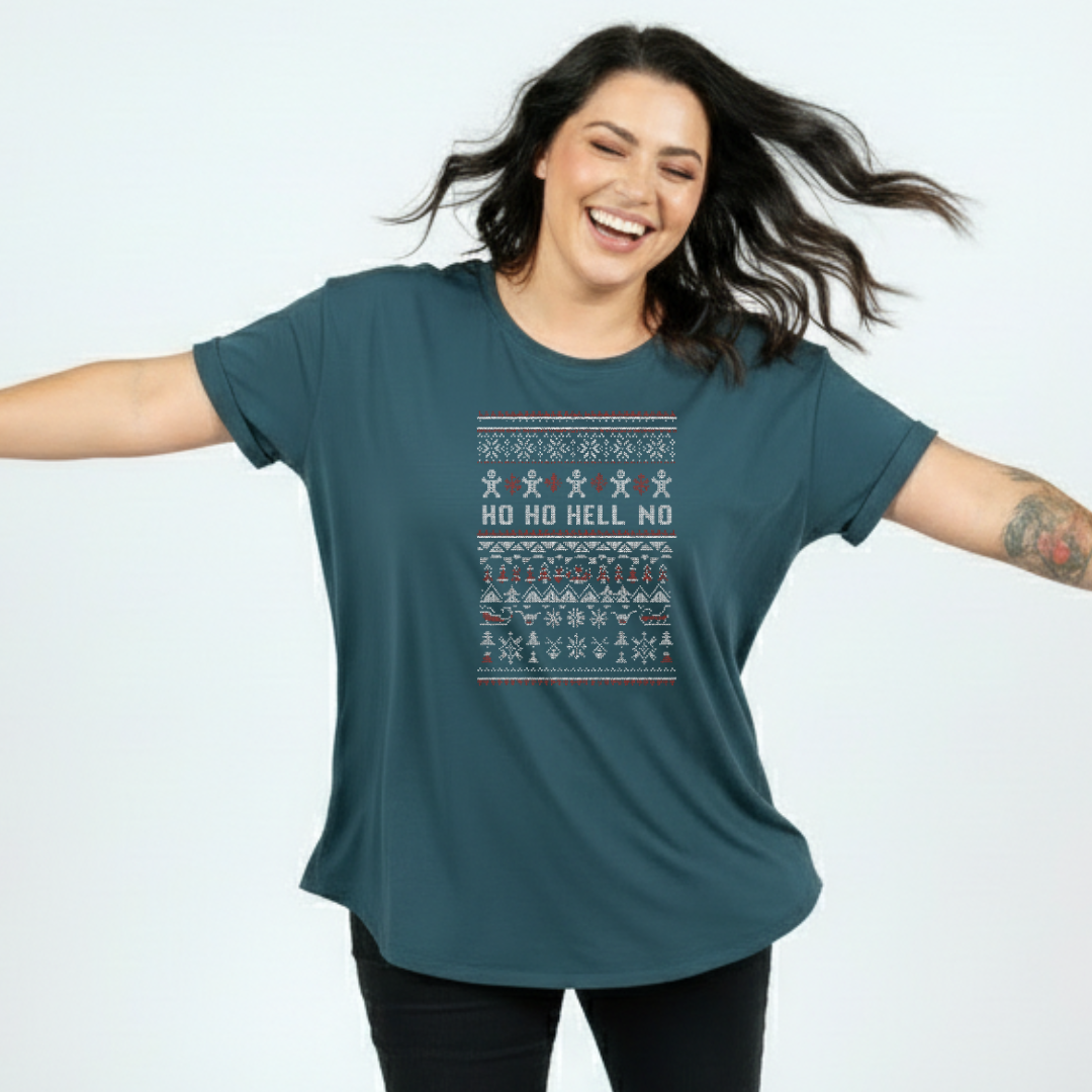 Woman wearing a teal t-shirt with a festive design and text on a light blue background