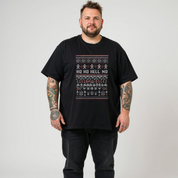 Man wearing a black t-shirt with a festive design and text on a plain background