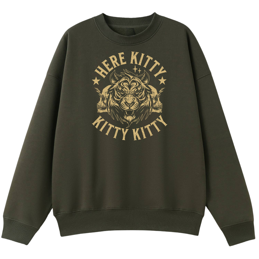 An olive green crewneck sweatshirt featuring a distressed gold graphic of a tiger's head with skulls on either side, surrounded by the text 'HERE KITTY KITTY KITTY KITTY' and small stars.