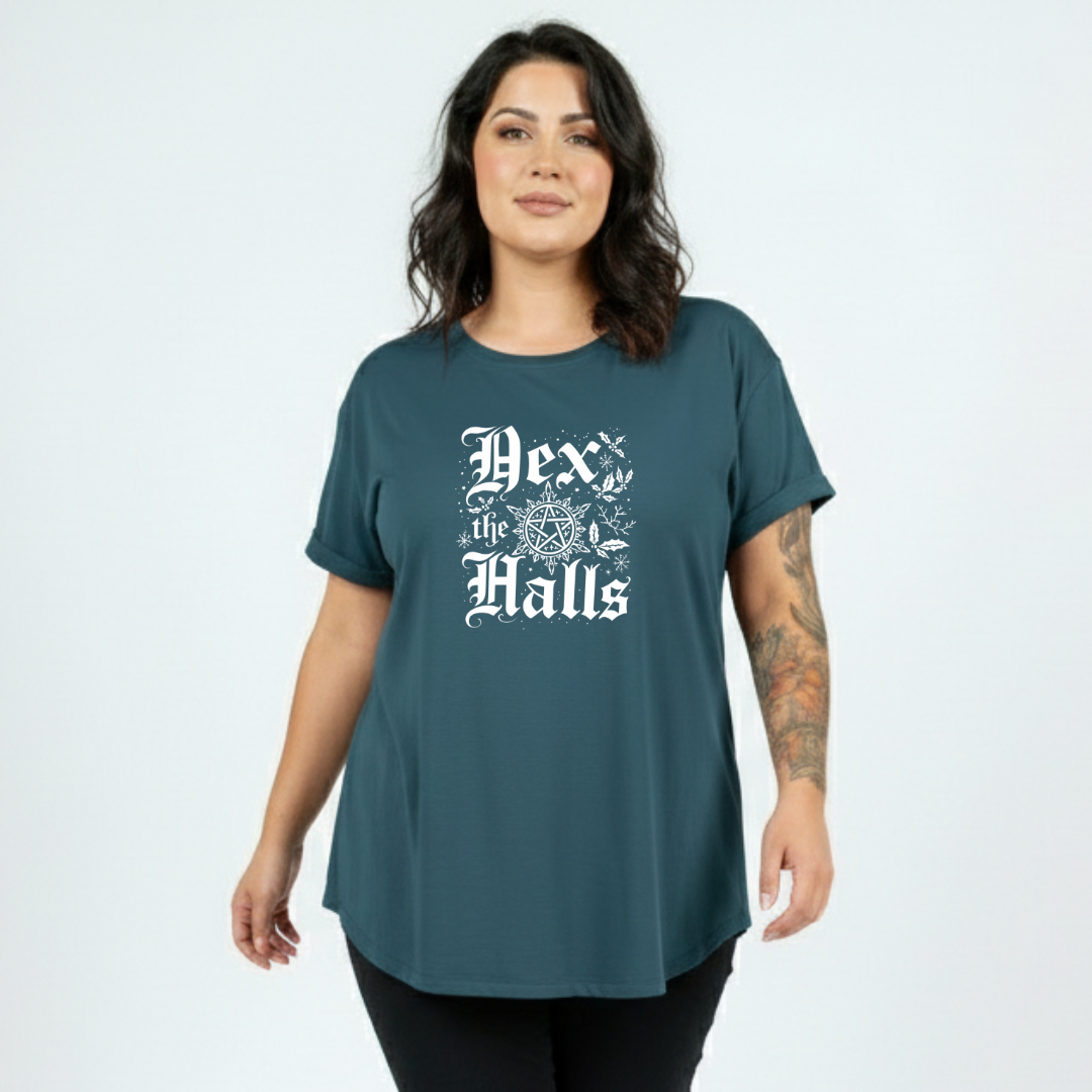 Woman wearing a teal t-shirt with white text on a plain background