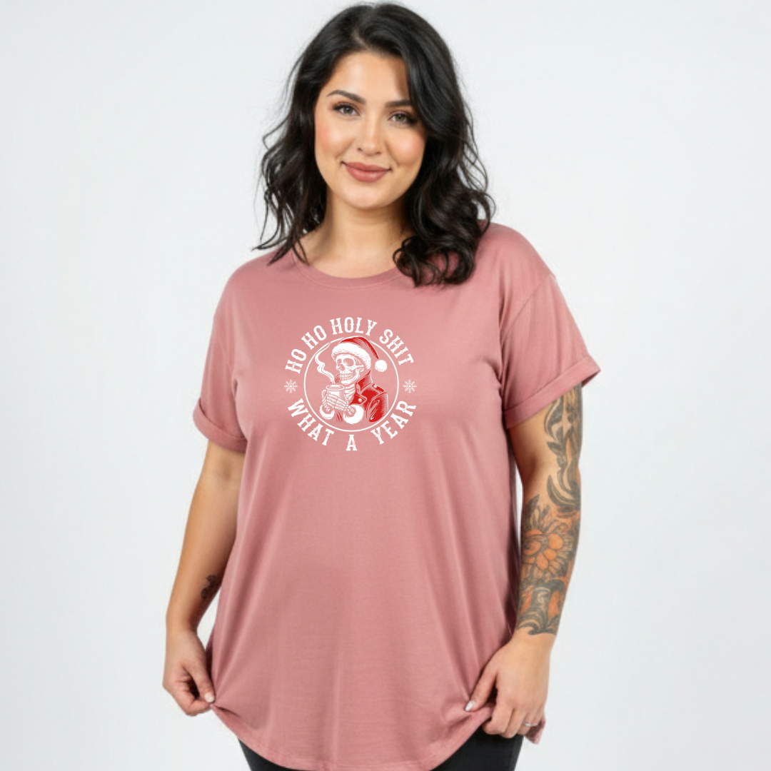 Woman wearing a pink t-shirt with a graphic design on a white background
