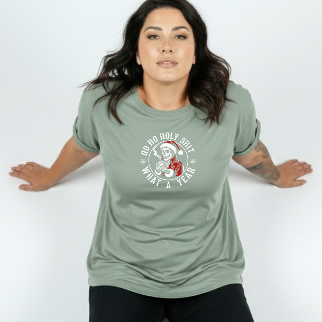 Woman wearing a green t-shirt with a graphic design on a white background