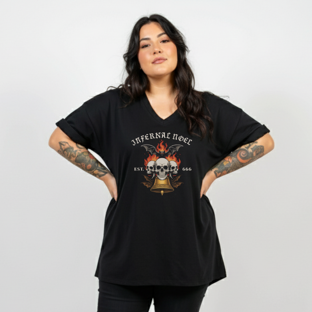 Woman wearing a black t-shirt with a graphic design on a plain background