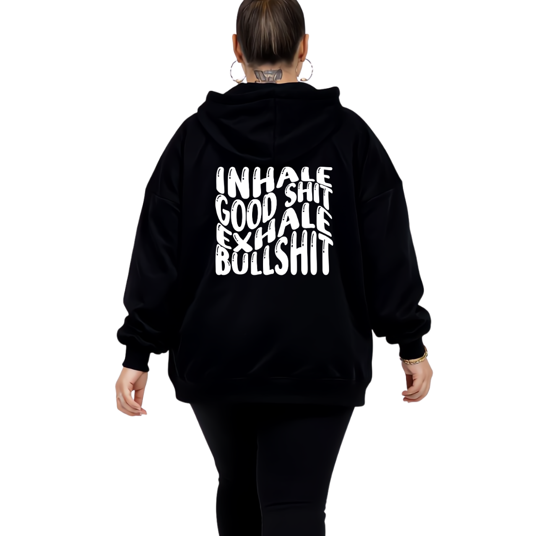 Woman wearing black oversized graphic hoodie with Inhale Good Shit Exhale Bullshit bold stacked white text DTF print, plus size Australian streetwear by Bae Bands
