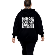 Woman wearing black oversized graphic hoodie with Inhale Good Shit Exhale Bullshit bold stacked white text DTF print, plus size Australian streetwear by Bae Bands