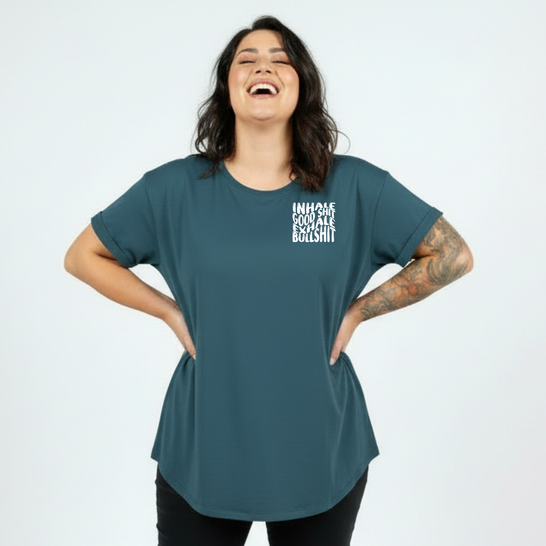 Close up of Inhale Good Shit Exhale Bullshit DTF print on teal oversized tee, bold wavy white stacked typography, Bae Bands Australia