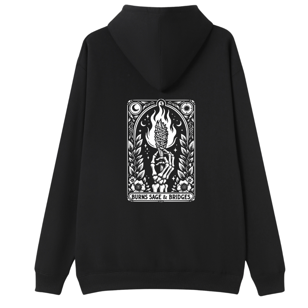 A black pullover hoodie shown from the back, featuring a large white graphic print on the center back with a tarot-style illustration and the text 'BURNS SAGE & BRIDGES'.