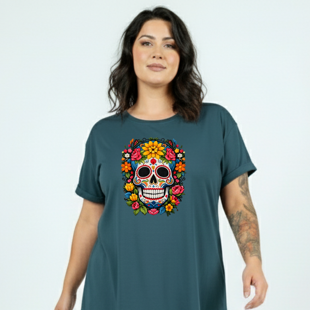 Woman wearing a teal t-shirt with a colorful skull design on a light gray background