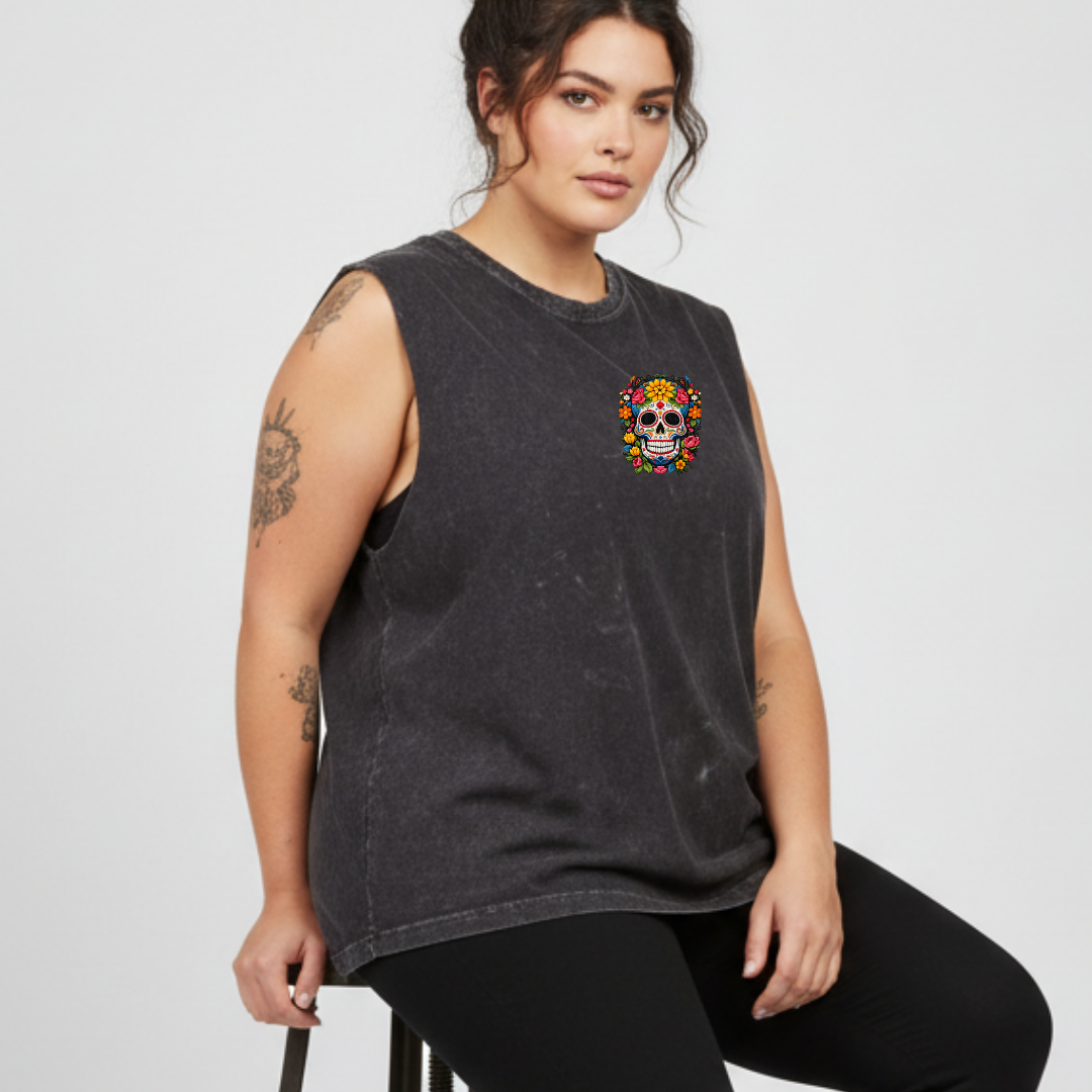 Woman wearing a dark gray sleeveless shirt with a colorful skull design on a white background