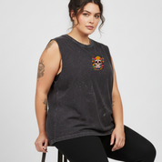 Woman wearing a dark gray sleeveless shirt with a colorful skull design on a white background