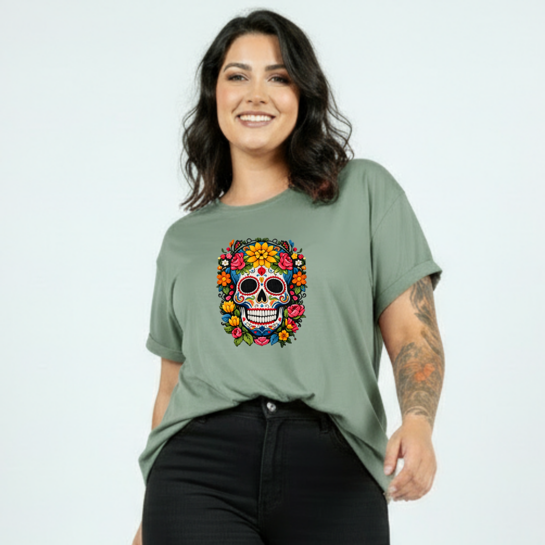 Woman wearing a green t-shirt with a colorful skull design on a plain background