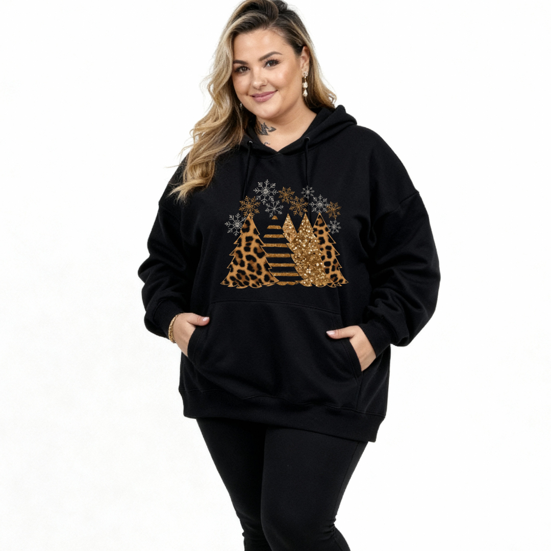Person wearing a black hoodie with a gold and leopard print design on a white background