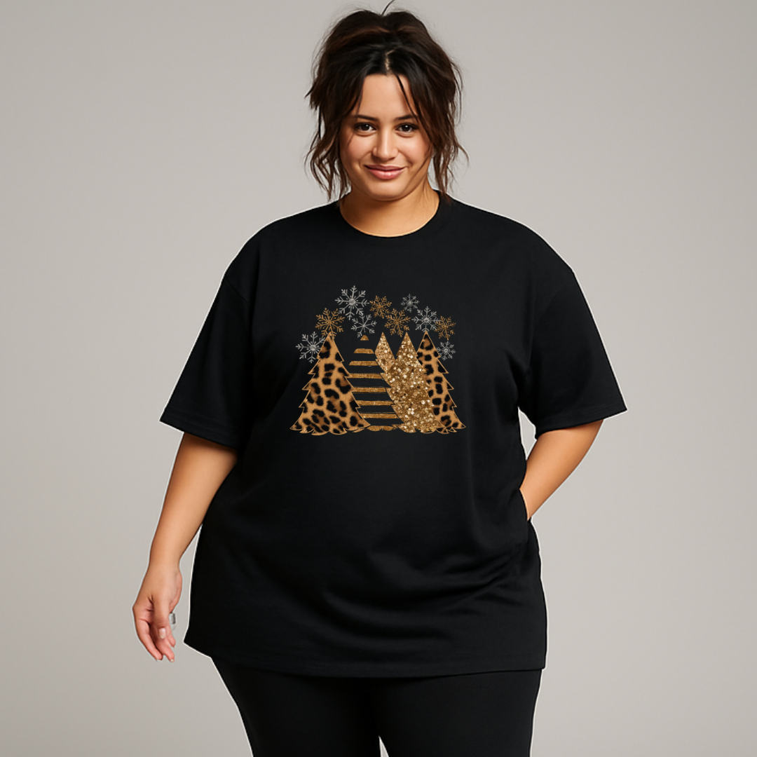 Person wearing a black t-shirt with a decorative design on a plain background