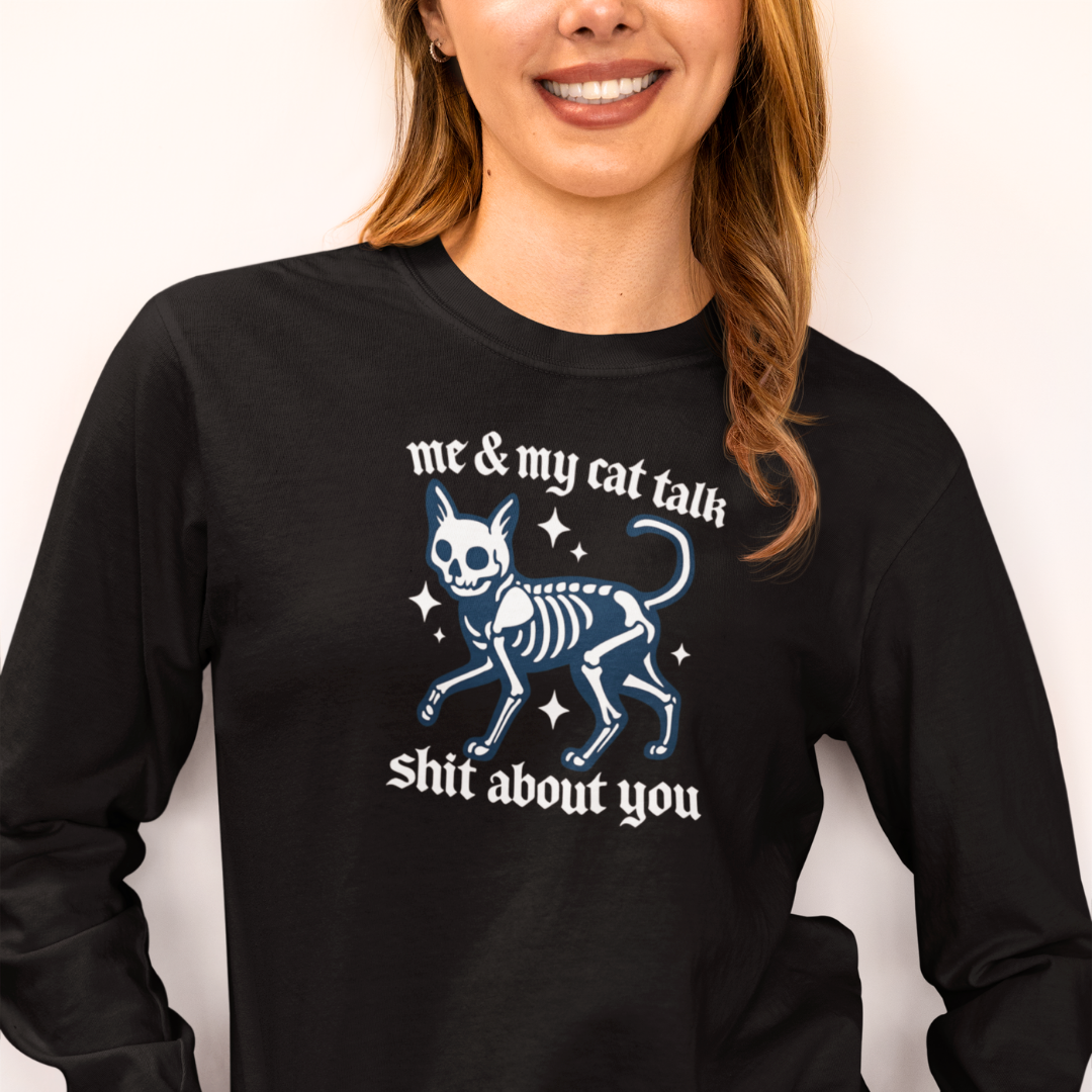 Person wearing a black long-sleeve shirt with a graphic design and text.