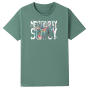 A sage green short-sleeve t-shirt with a graphic on the chest reading 'MENTAL DAY SETCY' in a textured, multicolored watercolor style, displayed on a solid white background.