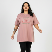 Woman wearing a pink t-shirt with text on a white background