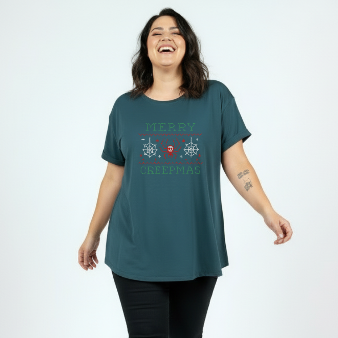 Woman wearing a teal t-shirt with text and graphics on a white background