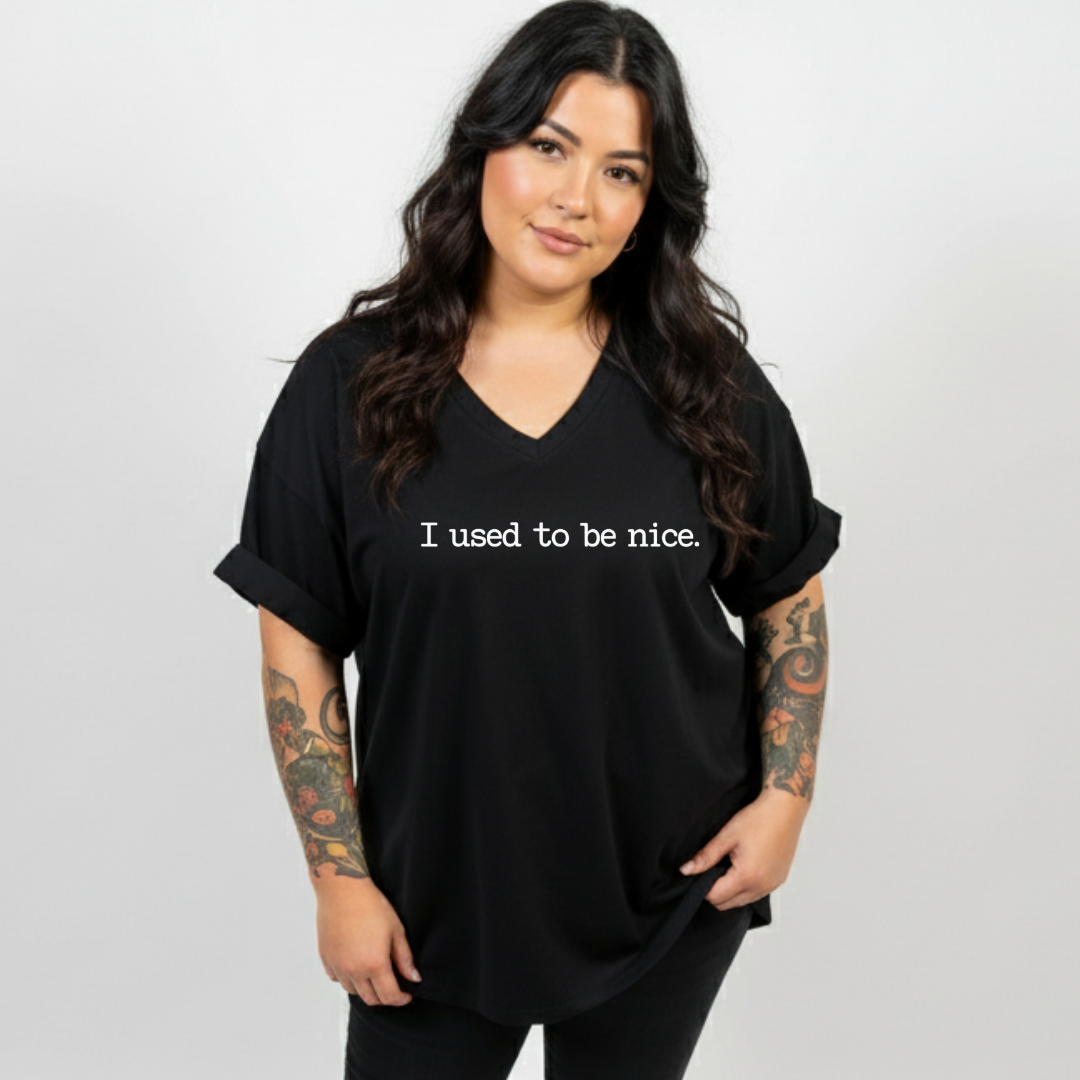 Woman wearing black v neck tee, relaxed fit, plus size Australian streetwear by Bae Bands