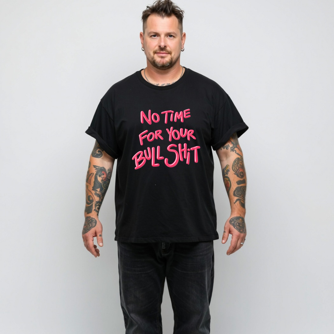 Man wearing a black t-shirt with pink text on a plain background