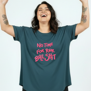 Person wearing a teal t-shirt with pink text on a white background