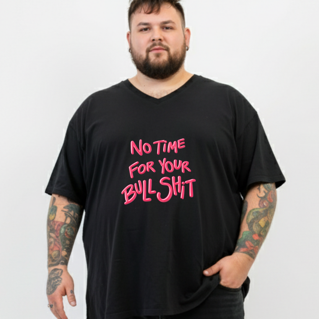 Person wearing a black t-shirt with pink text on a white background