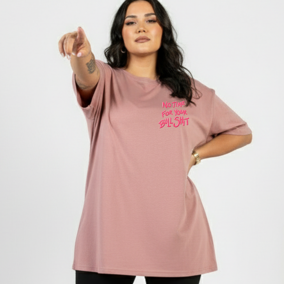 Woman wearing a pink t-shirt with text on a white background