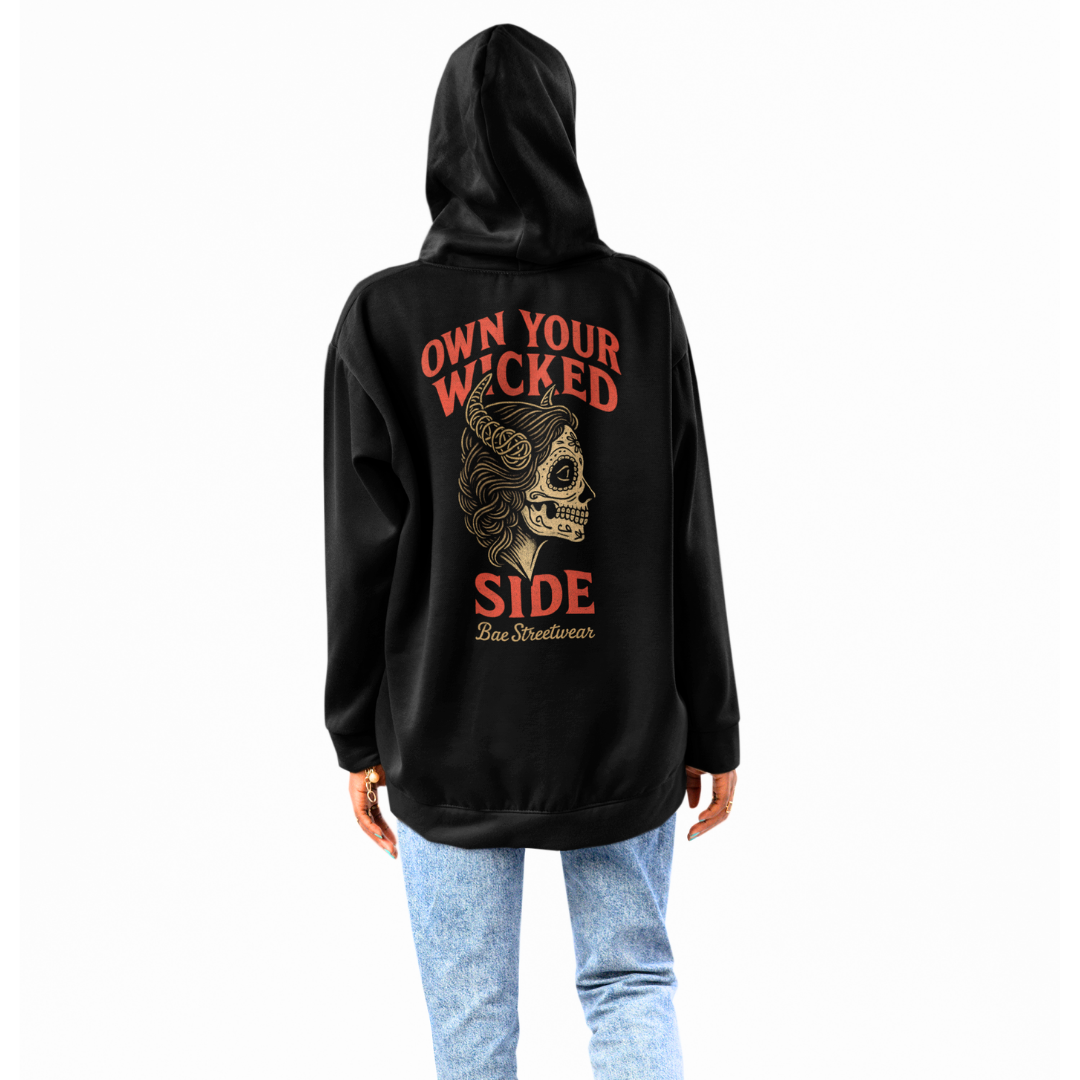Melbourne streetwear hoodie featuring a sugar skull woman with horns and the phrase “Own Your Wicked Side"