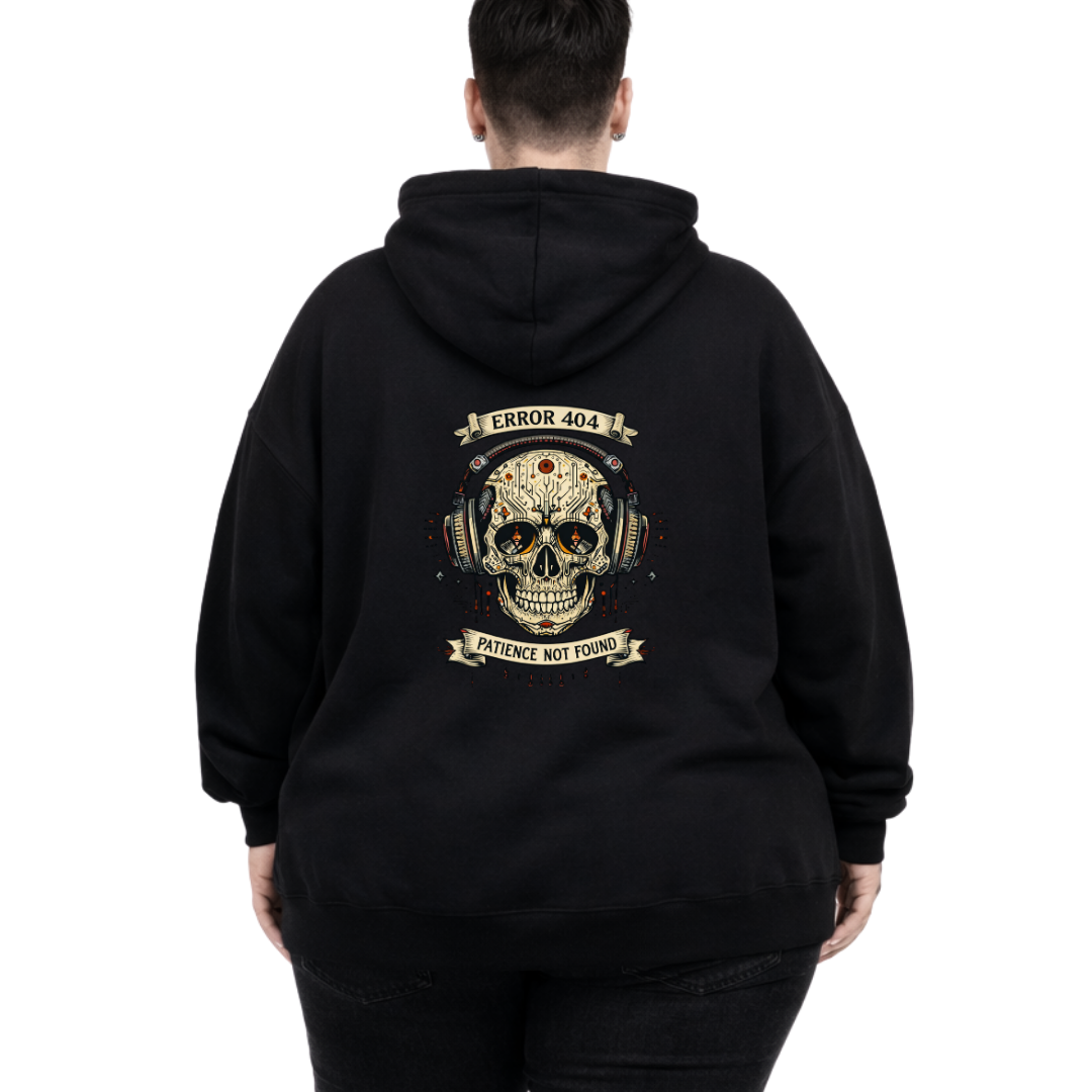 Woman wearing black oversized graphic hoodie with Error 404 Patience Not Found cyber skull in headphones DTF print, plus size Australian streetwear by Bae Bands