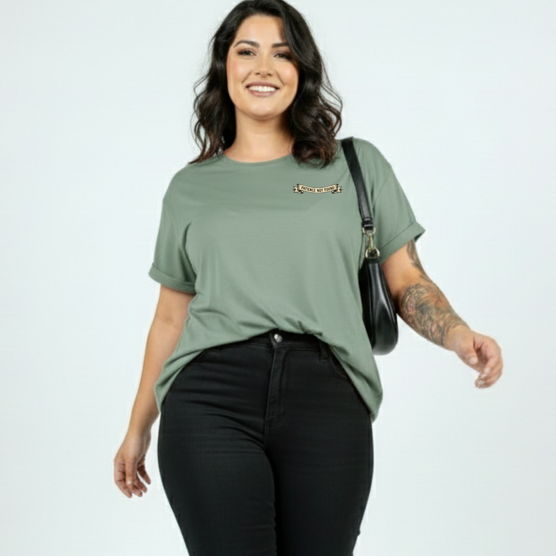 Woman wearing slate green oversized graphic tee with Error 404 Patience Not Found cyber skull design, plus size Australian streetwear by Bae Bands