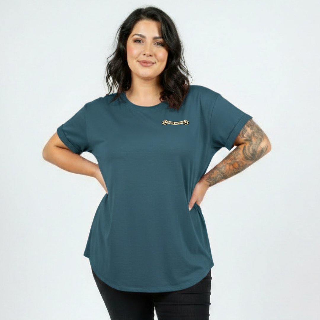 Woman wearing teal oversized graphic tee with Error 404 Patience Not Found cyber skull in headphones design, plus size Australian made streetwear