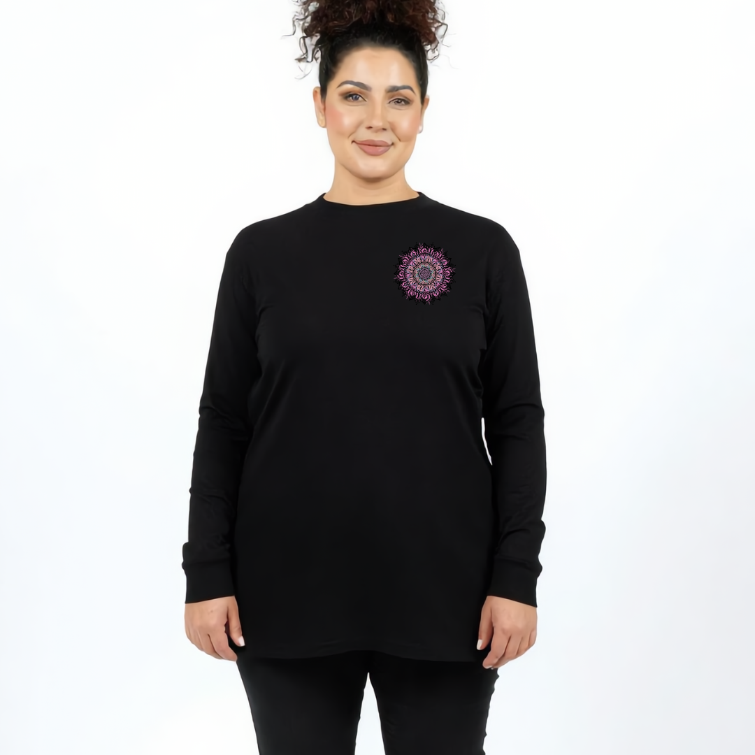 Woman wearing black long sleeve graphic tee with large intricate pink and teal mandala back print, plus size Australian streetwear by Bae Bands