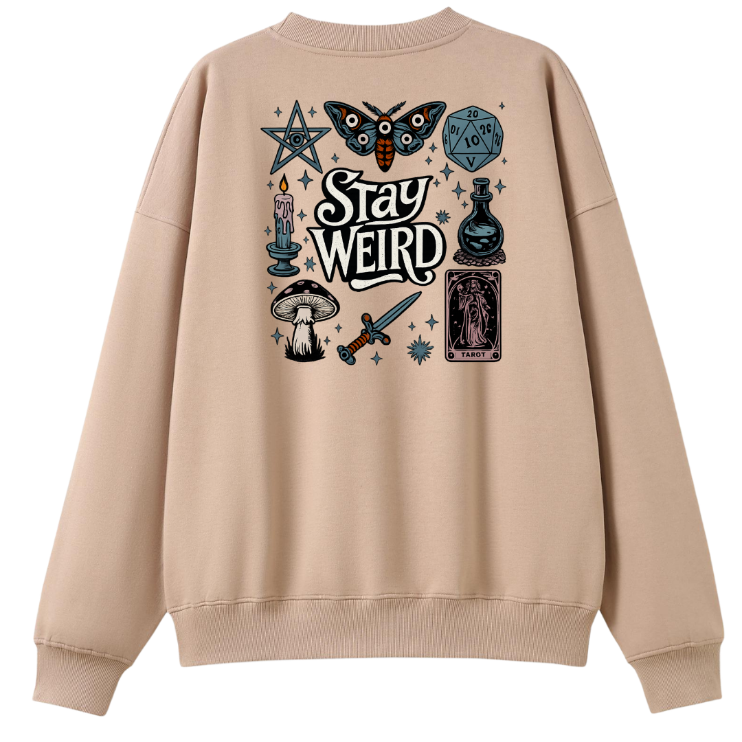 A beige crewneck sweatshirt shown from the back, featuring a detailed graphic print with occult and fantasy illustrations including a moth, dagger, mushroom, tarot card, and the words 'Stay Weird'.