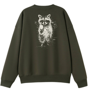 An oversized crewneck sweatshirt in dark olive green, featuring a large white distressed graphic of a raccoon on the back.