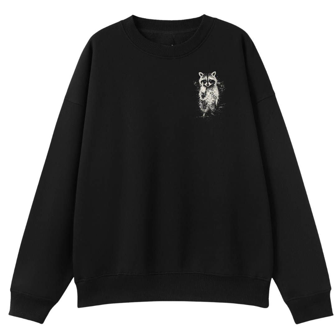 A black crewneck sweatshirt with a small white distressed raccoon graphic on the left chest, displayed against a solid white background.