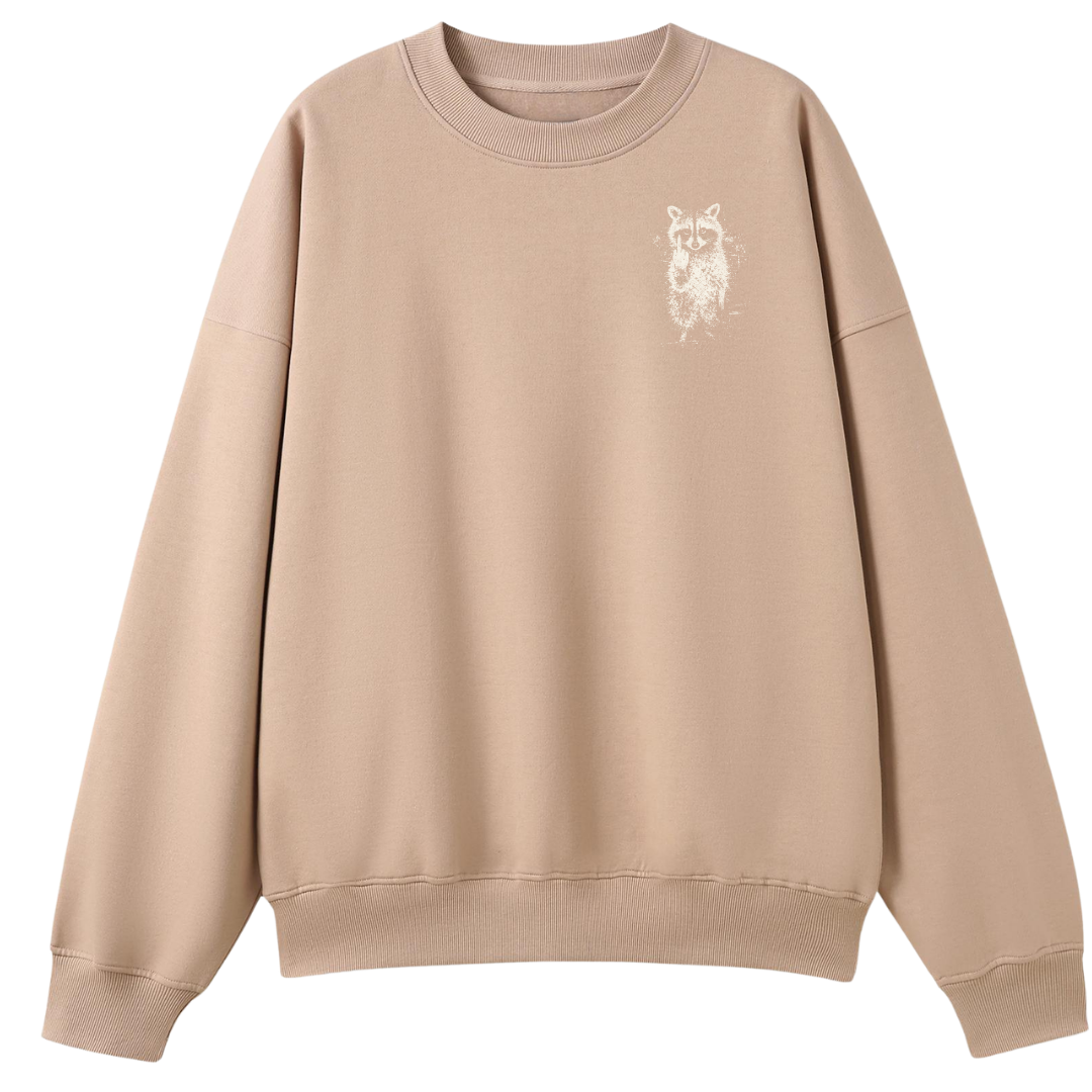 A beige crewneck sweatshirt with a small white graphic of a raccoon on the left chest, displayed on a clean white background.
