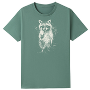 A sage green short-sleeve crewneck t-shirt featuring a distressed white graphic of a raccoon holding a small object in its paws, displayed on a solid white background.