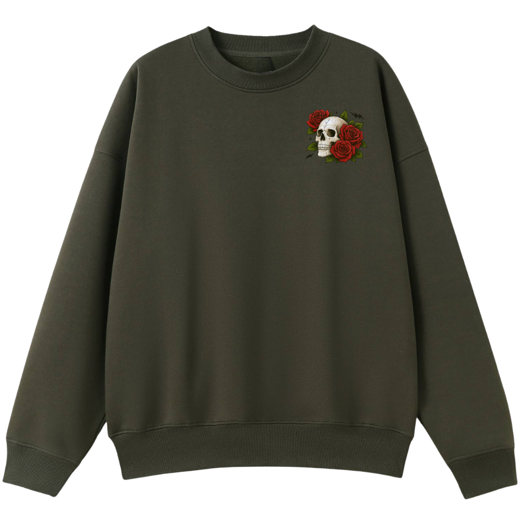 An oversized crewneck sweatshirt in dark olive green, featuring a small embroidered graphic on the left chest of a white skull surrounded by red roses.